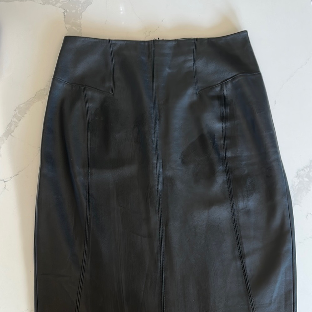 Express faux leather black pencil skirt with zip up back and raw hem. Size 12
